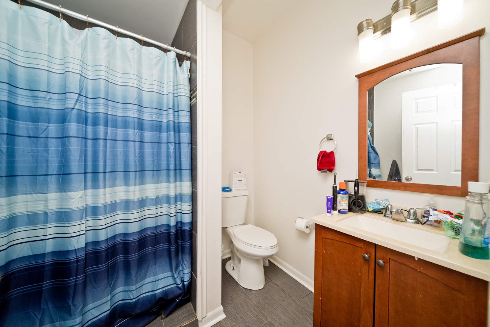1431 West Flournoy Street, Unit 2R Chicago, IL 60607 - Photo 9 of 9 a bathroom with a sink a toilet and shower