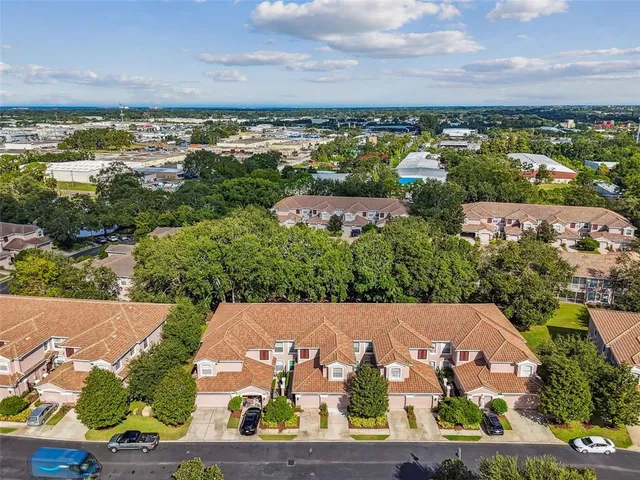 a view of a patio with table and chairs under an umbrella