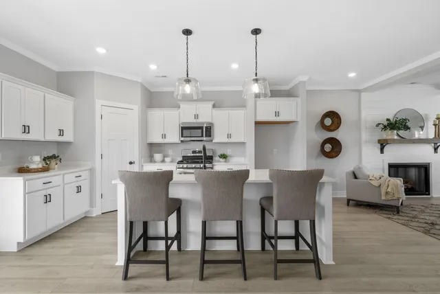 a large kitchen with a table and chairs