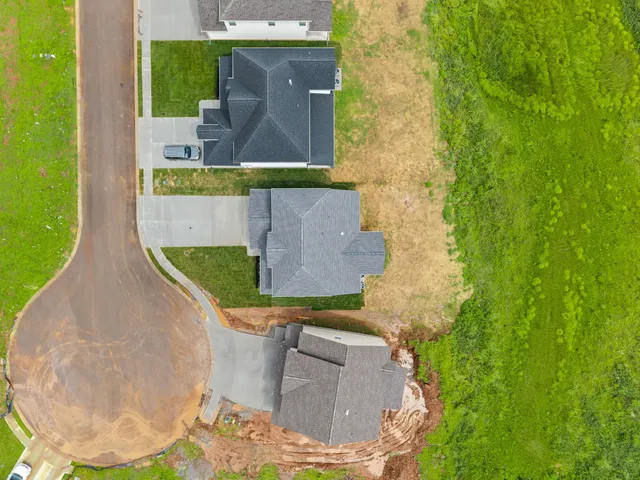 front view of a house with a fountain