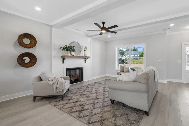 a living room with furniture and a fireplace