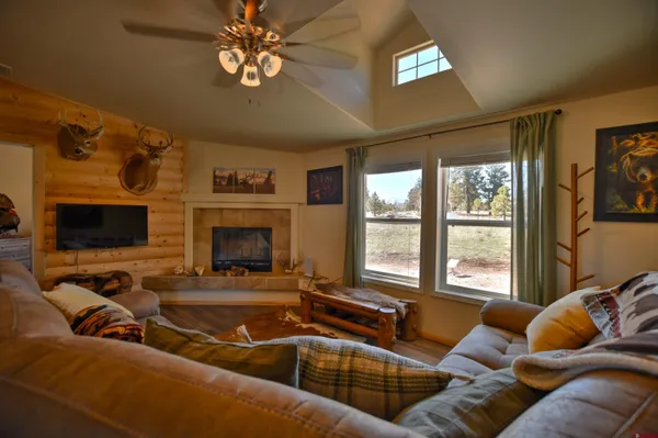 a kitchen with granite countertop stainless steel appliances a refrigerator cabinets and a sink