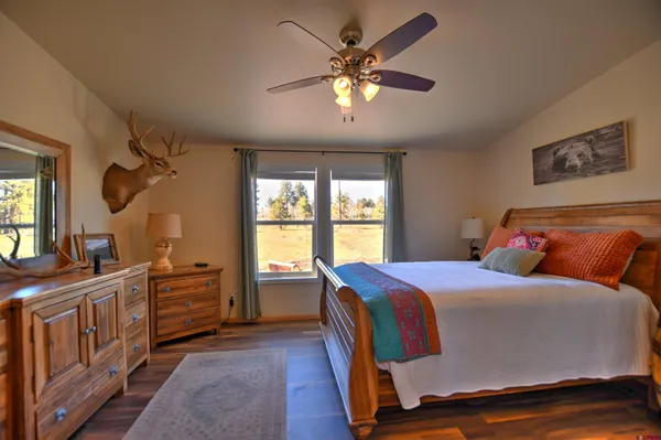 a bedroom with bed and window