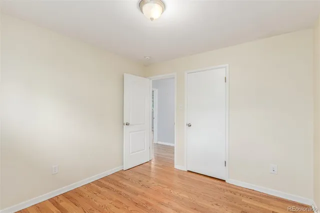 a bathroom with a granite countertop sink and a large mirror
