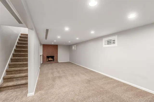 a view of room with empty cabinets and empty racks