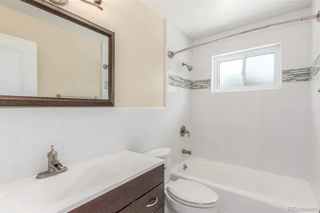 a view of room with empty cabinets and empty racks