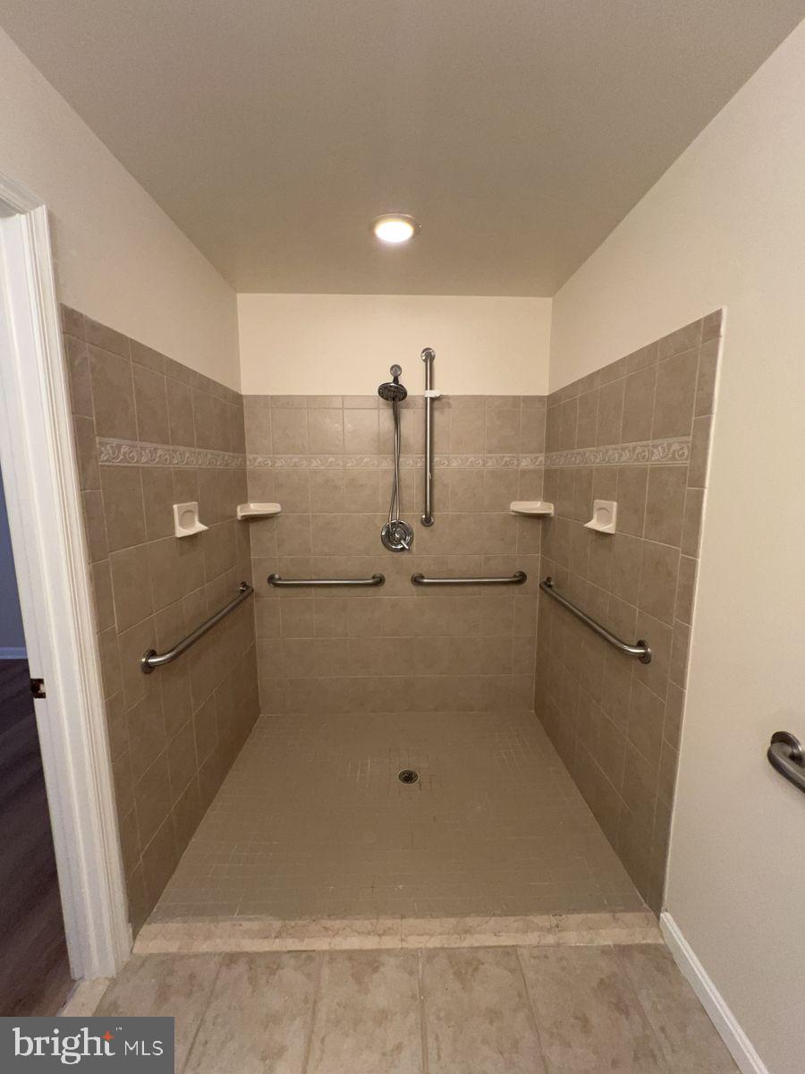 2400 Ellsworth Way, Unit 1C Frederick, MD 21702 - Photo 13 of 17 a bathroom with a shower