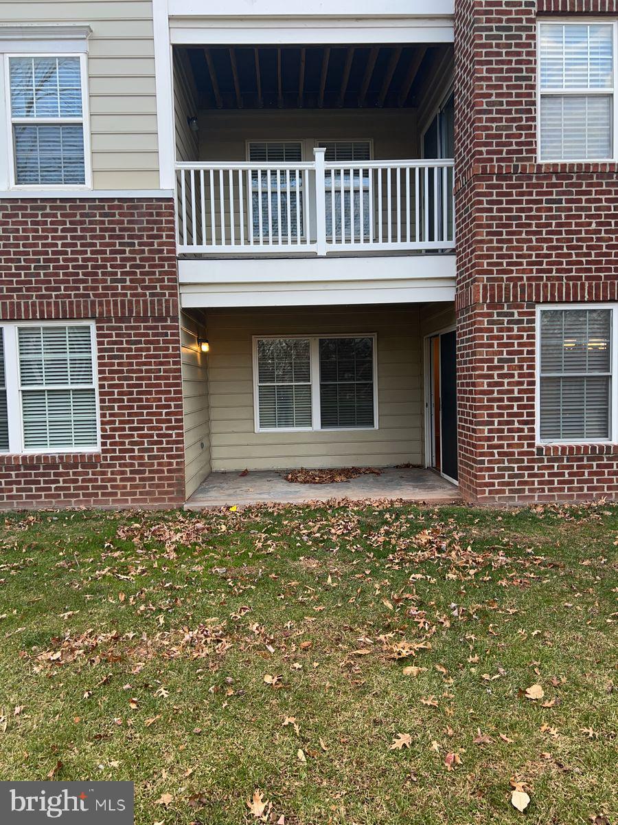 2400 Ellsworth Way, Unit 1C Frederick, MD 21702 - Photo 17 of 17 a front view of a house with a garden