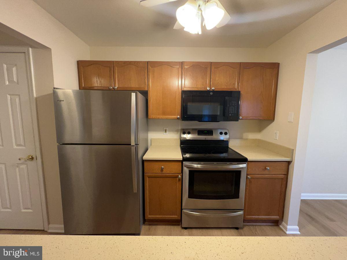 2400 Ellsworth Way, Unit 1C Frederick, MD 21702 - Photo 8 of 17 a kitchen with a refrigerator stove and microwave