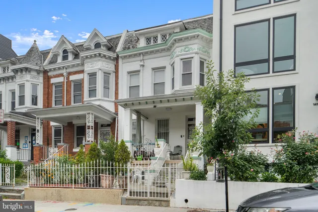 front view of a building with a garden