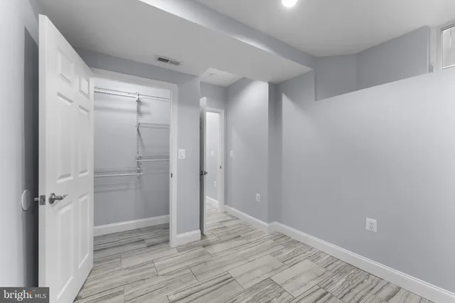 a bathroom with a shower and a glass door