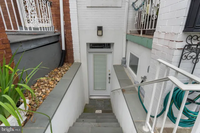 a view of an entryway with wooden floor