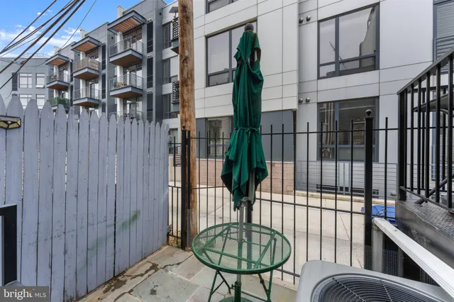 a view of balcony with furniture