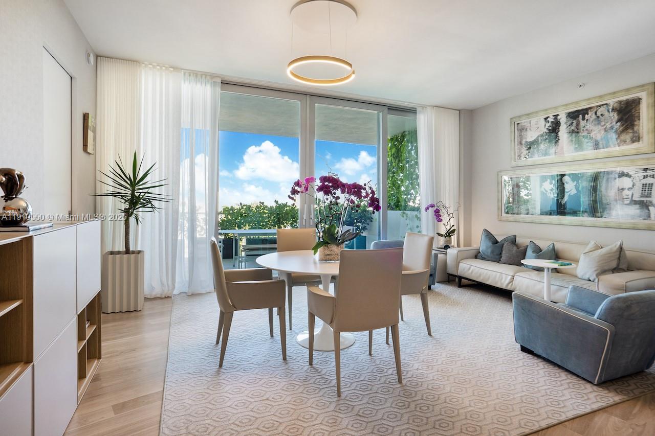 1300 Monad Terrace, Unit 7C Miami Beach, FL 33139 - Photo 6 of 16 a living room with furniture potted plant and a fireplace