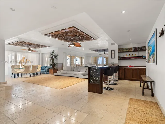 a bedroom with two beds and a chandelier