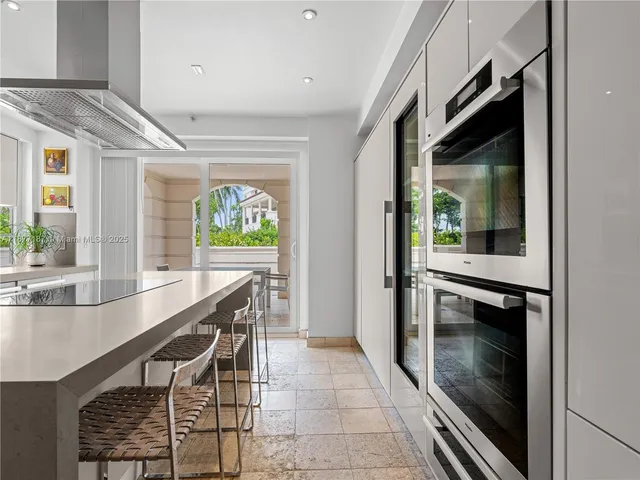 a spacious bathroom with a tub shower and toilet