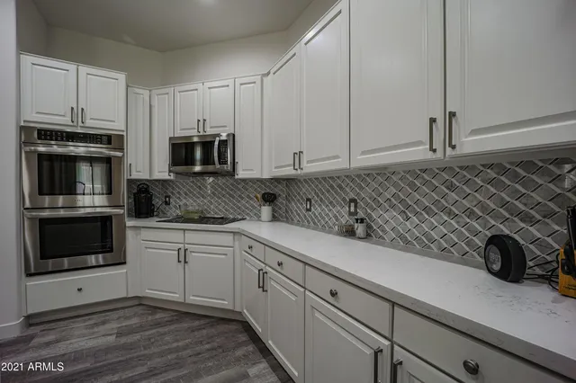 a kitchen with a sink and cabinets