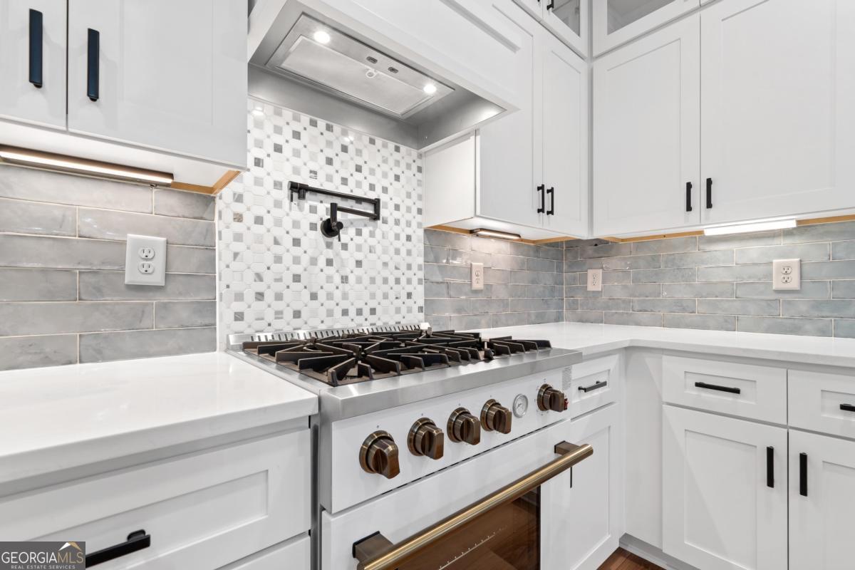 118 Southshore Road Eatonton, GA 31024 - Photo 16 of 42 a white stove top oven sitting inside of a kitchen