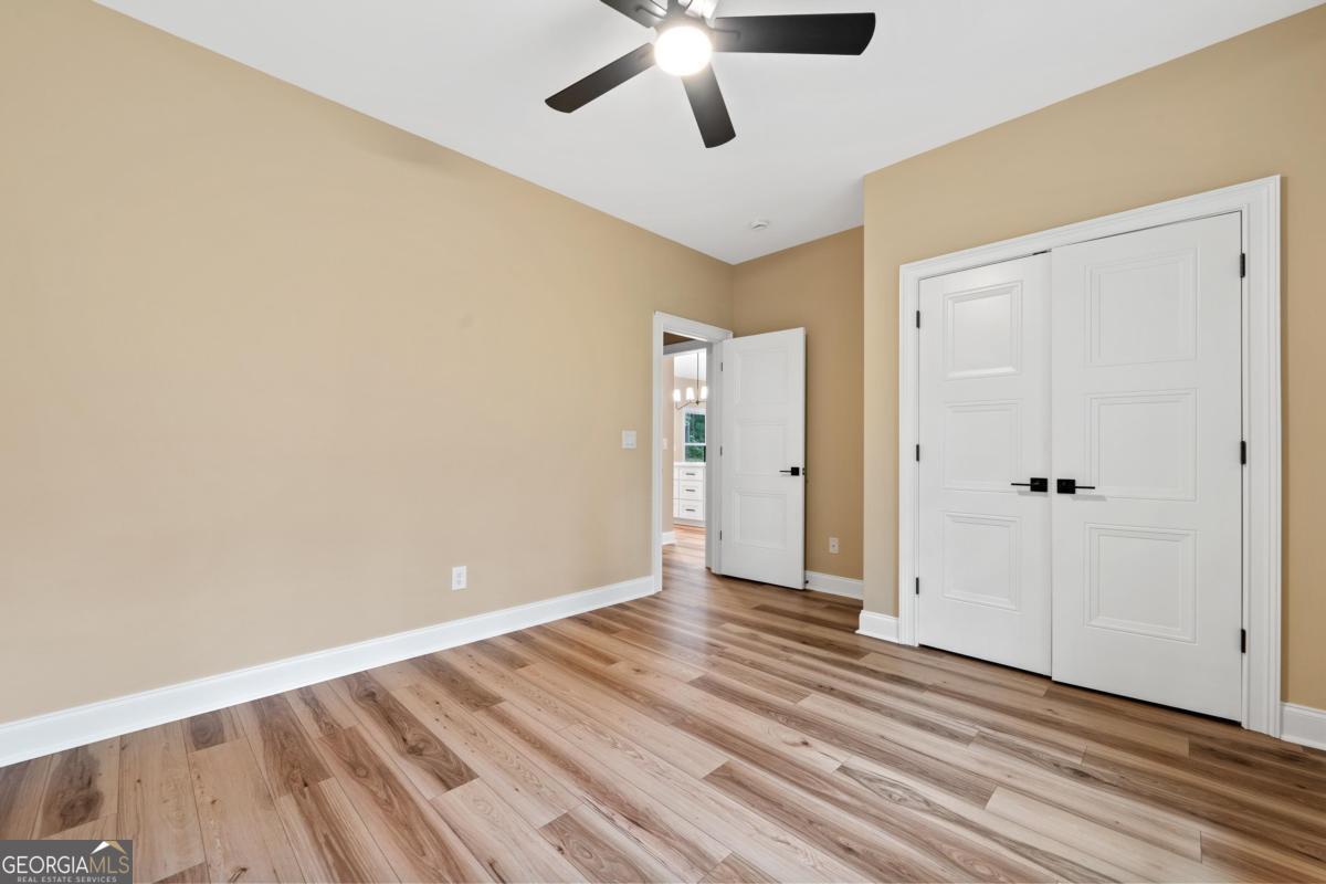 118 Southshore Road Eatonton, GA 31024 - Photo 33 of 42 wooden floor in an empty room