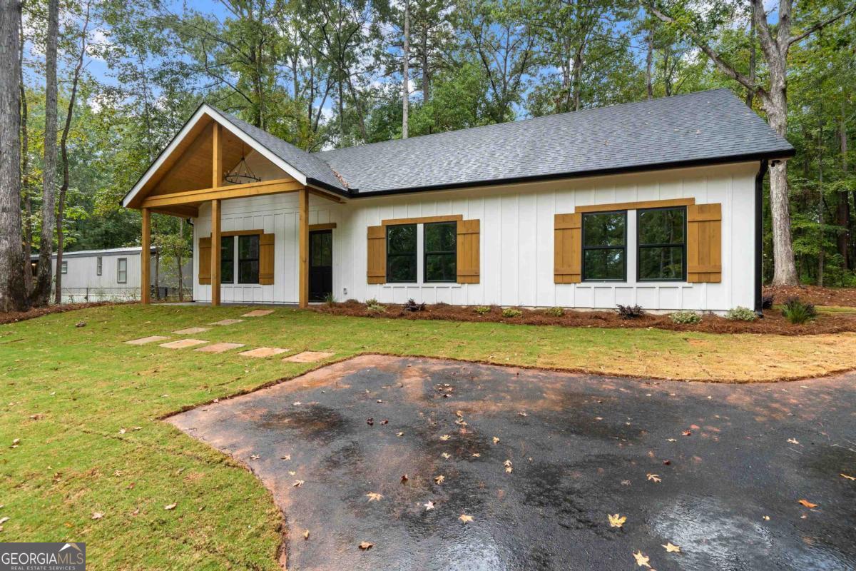 118 Southshore Road Eatonton, GA 31024 - Photo 40 of 42 a view of a house with swimming pool and porch with furniture