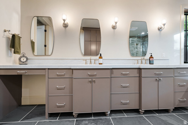 1141 South Oak Leaf Lane Springville, UT 84663 - Photo 59 of 147 Dual vanity featuring a light countertop, integrated sinks, brushed nickel fixtures, and multiple storage cabinets with drawers