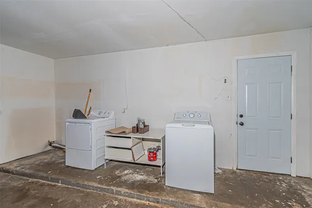 a view of a yard with a house in the background