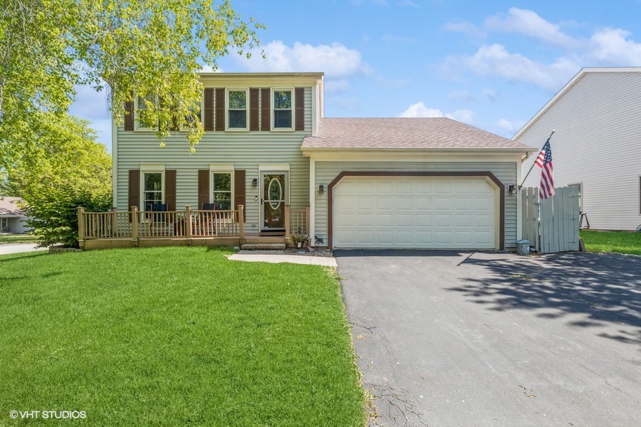198 Foxmoor Road Fox River Grove, IL 60021 - Photo 1 of 26 a front view of a house with a yard and garage