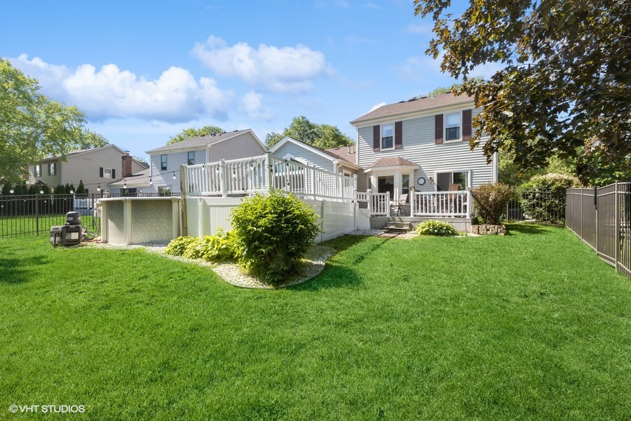 198 Foxmoor Road Fox River Grove, IL 60021 - Photo 2 of 26 a front view of a house with a yard table and chairs