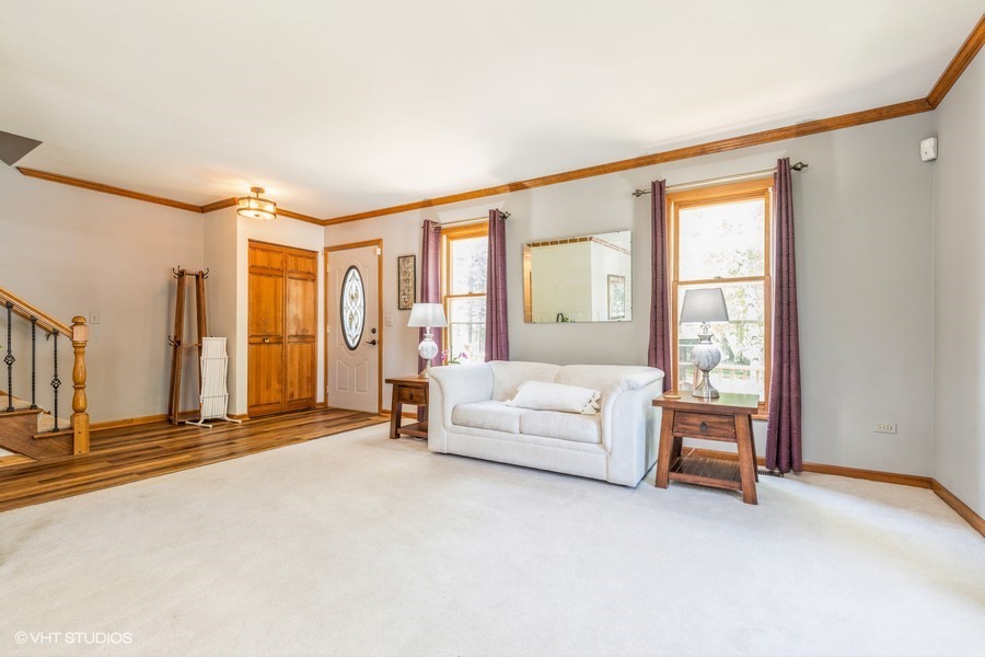 198 Foxmoor Road Fox River Grove, IL 60021 - Photo 7 of 26 a living room with furniture and large windows