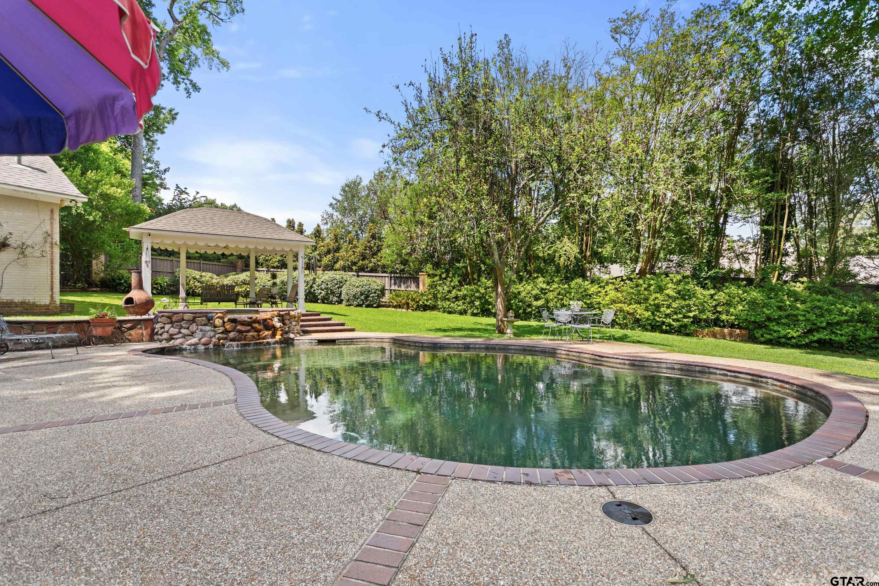 2631 Old Bullard Road Tyler, TX 75701 - Photo 4 of 43 a view of a swimming pool with a patio