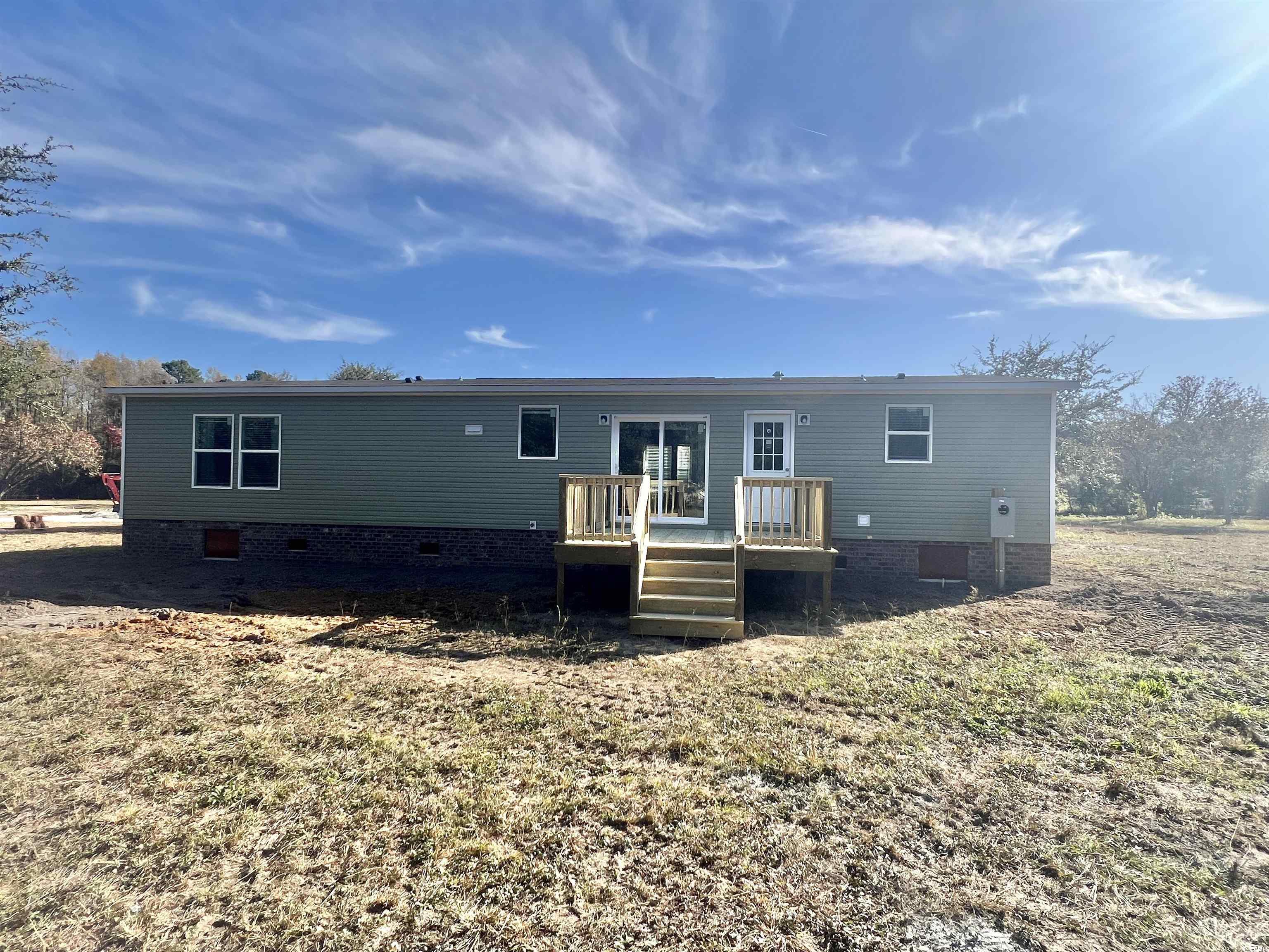 2004 Warren's Loop Marion, SC 29571 - Photo 3 of 20 Back of property featuring crawl space and a wooden deck