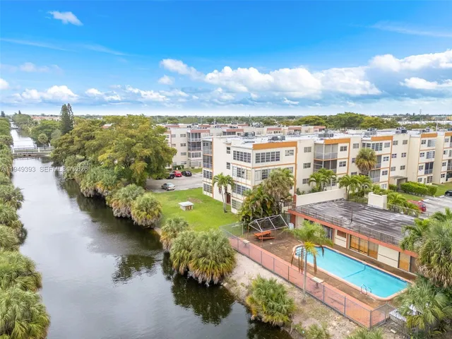a view of a terrace with lawn chairs