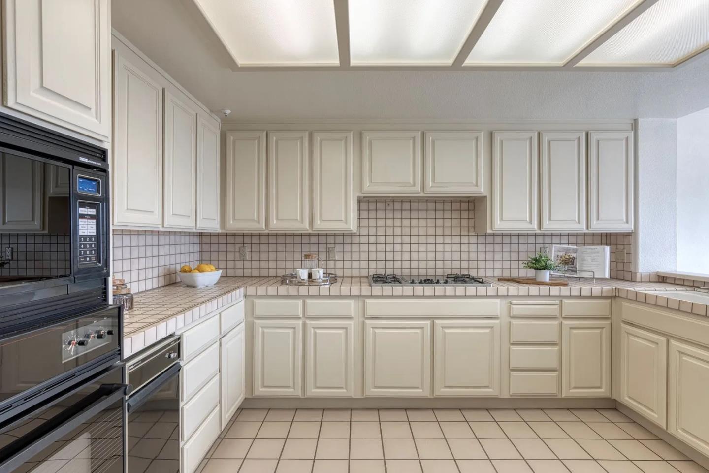 7 Iris Lane San Carlos, CA 94070 - Photo 9 of 17 a kitchen with a sink stove and cabinets
