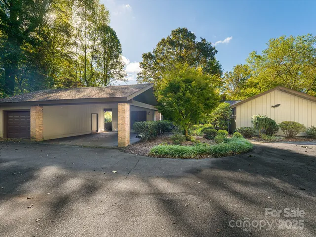 a view of a house with a yard and garage
