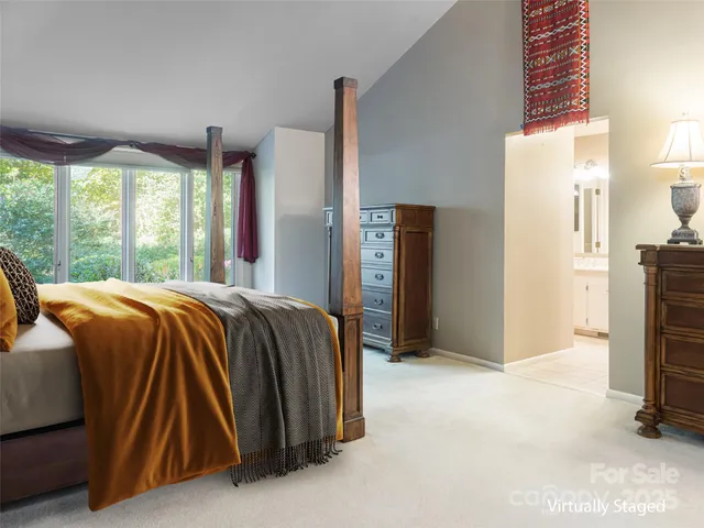 a view of room with window and refrigerator