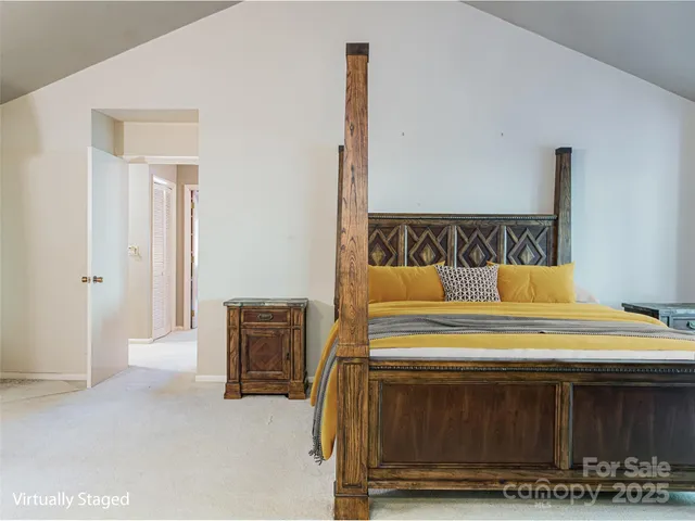 a bathroom with a granite countertop sink mirror and a toilet