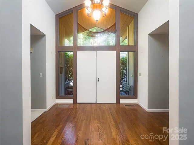 hallway view with wooden floor