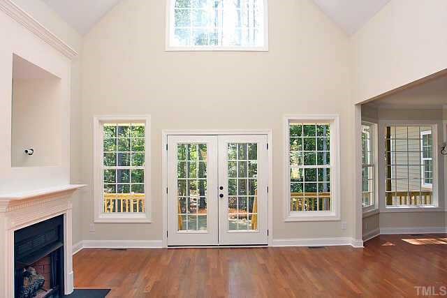 4911 Biscayne Road Durham, NC 27707 - Photo 3 of 10 Large family room with wall of windows looking out towards the private backyard!