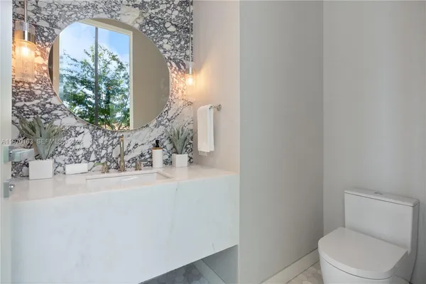 a bathroom with a toilet and a sink