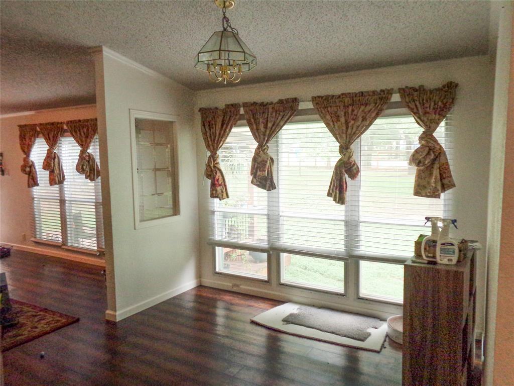 5525 Cedar Oaks Road Grandview, TX 76050 - Photo 9 of 40 Large windows and dark wood floors