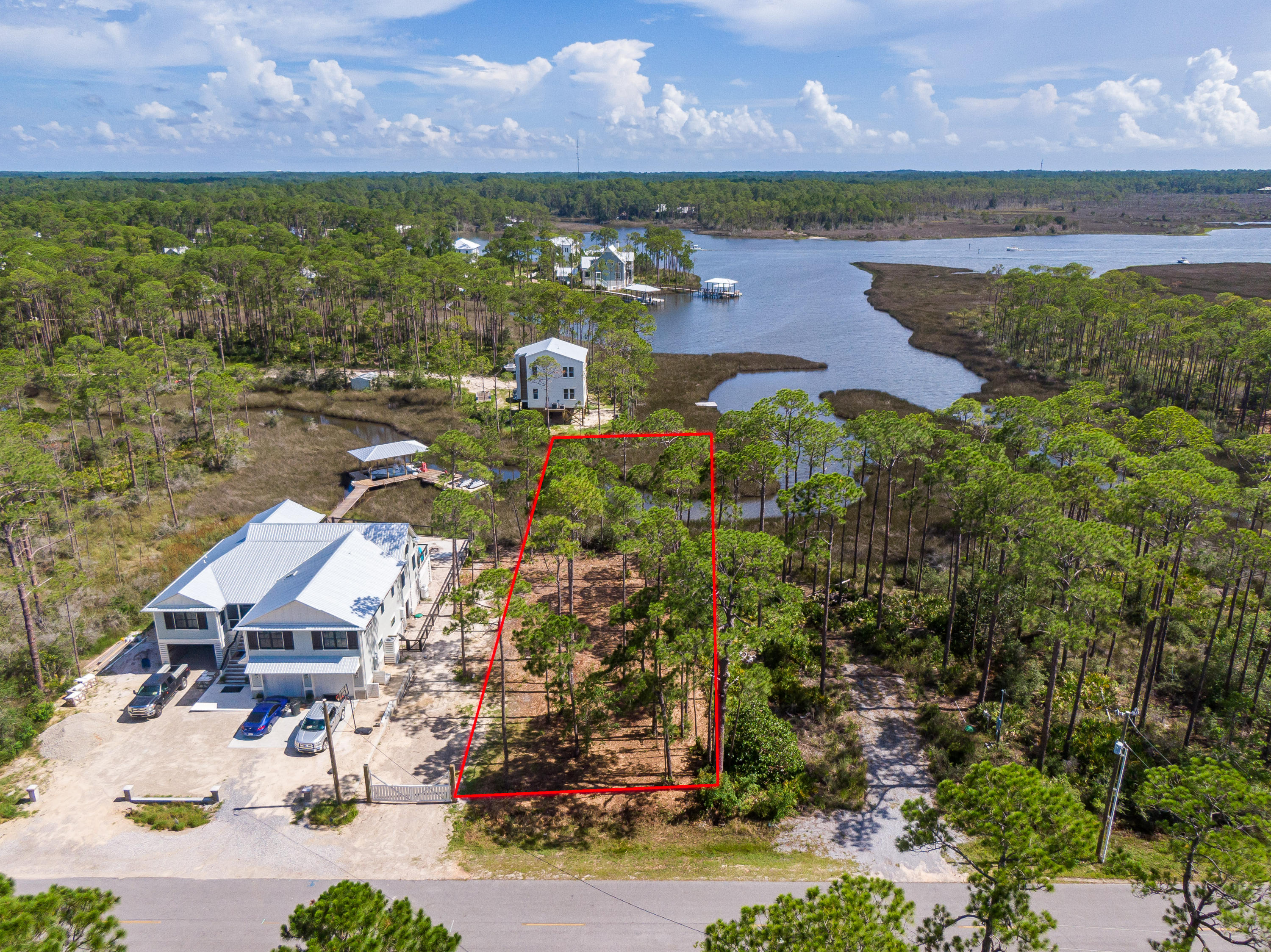 Lot 13 West Nursery Road Santa Rosa Beach, FL 32459 - Photo 4 of 23 an aerial view of residential houses with outdoor space and lake view