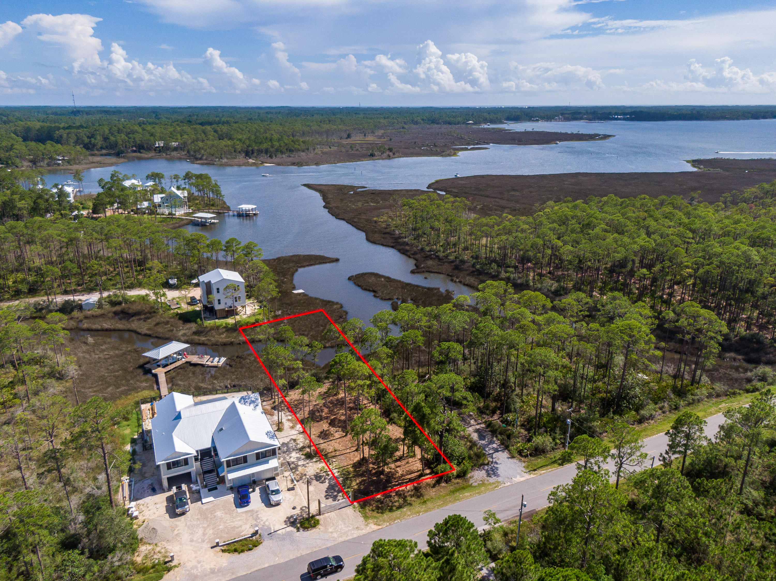 Lot 13 West Nursery Road Santa Rosa Beach, FL 32459 - Photo 6 of 23 an aerial view of a houses with a lake view