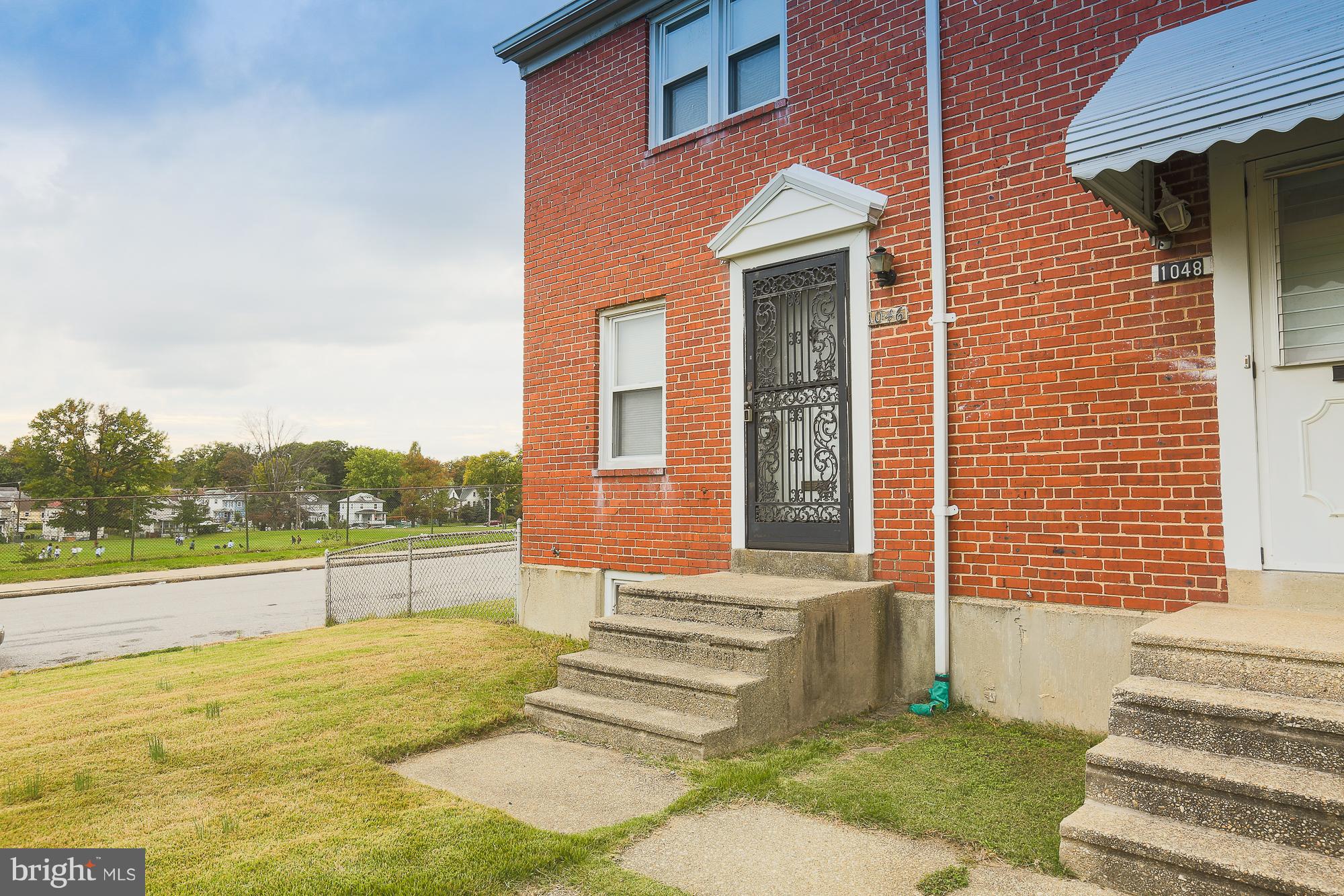 1046 Tunbridge Road Baltimore, MD 21212 - Photo 1 of 30 a front view of a house with a yard