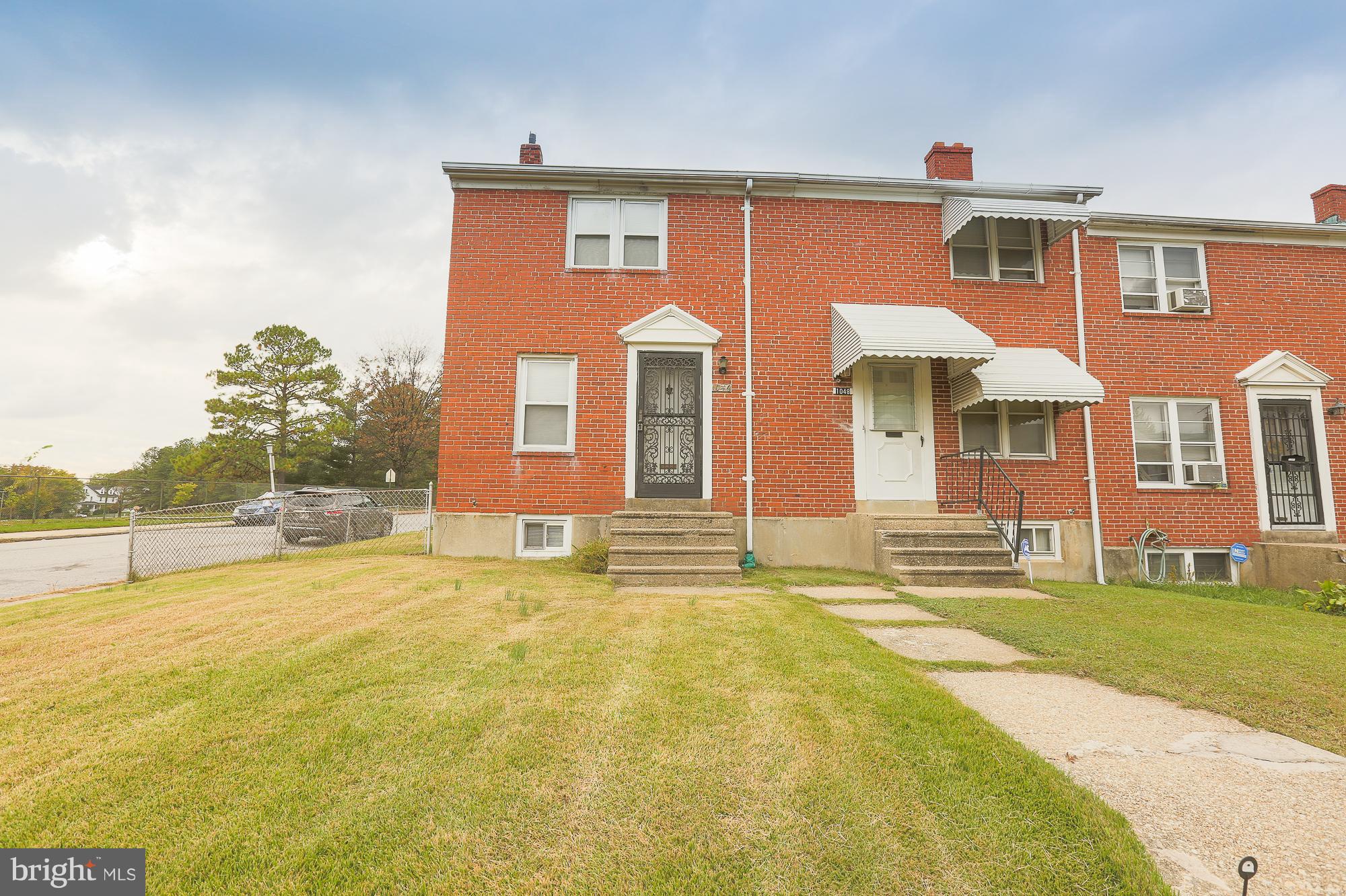 1046 Tunbridge Road Baltimore, MD 21212 - Photo 3 of 30 a front view of a house with a garden and outdoor seating