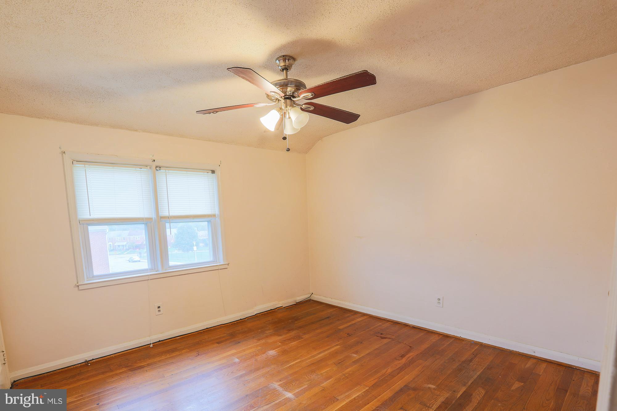 1046 Tunbridge Road Baltimore, MD 21212 - Photo 21 of 30 an empty room with a window and a fan