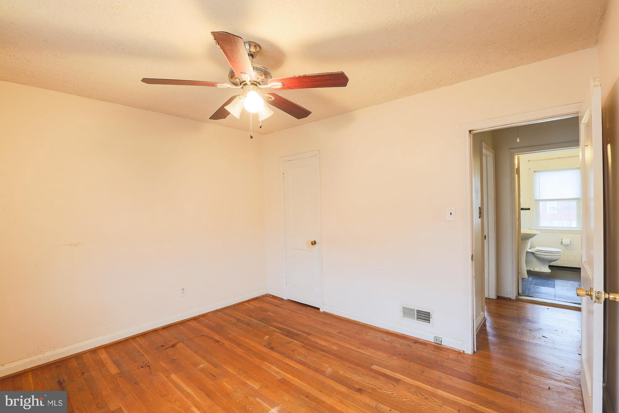 1046 Tunbridge Road Baltimore, MD 21212 - Photo 22 of 30 a view of empty room with wooden floor