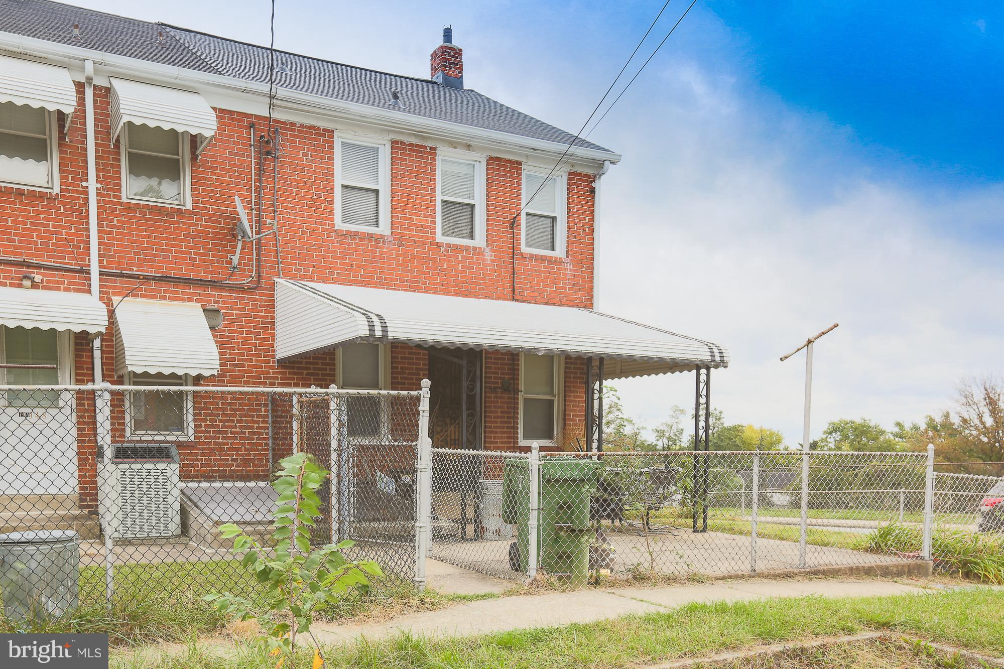 1046 Tunbridge Road Baltimore, MD 21212 - Photo 29 of 30 a front view of a house with a yard