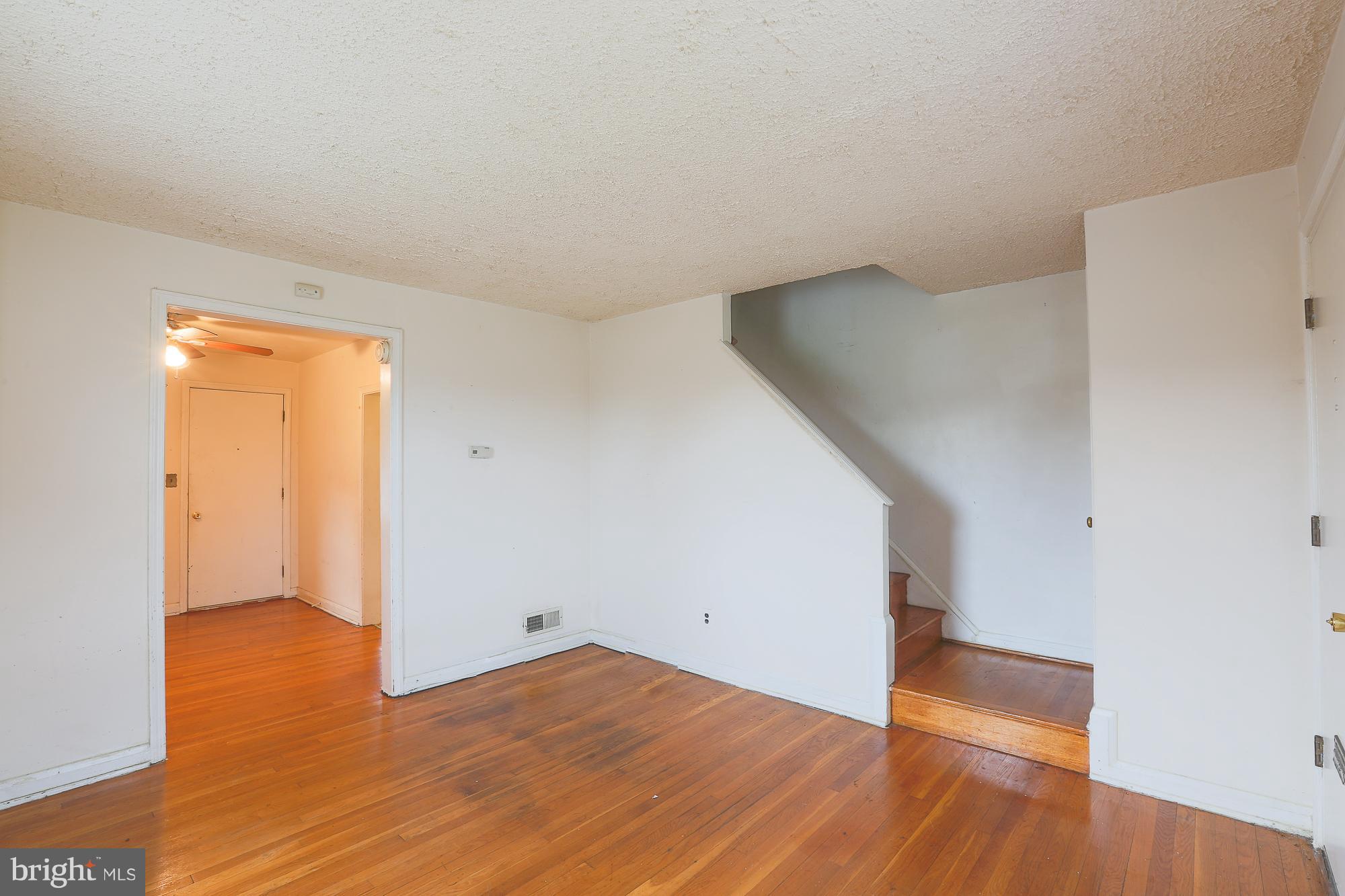 1046 Tunbridge Road Baltimore, MD 21212 - Photo 7 of 30 a view of an empty room with wooden floor