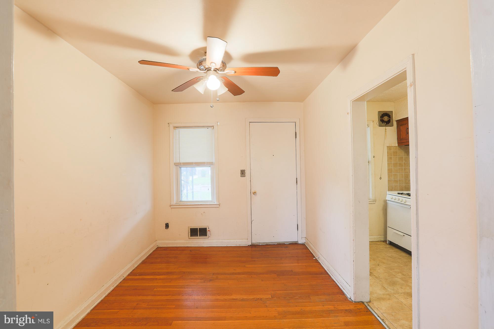 1046 Tunbridge Road Baltimore, MD 21212 - Photo 9 of 30 a view of an empty room with wooden floor