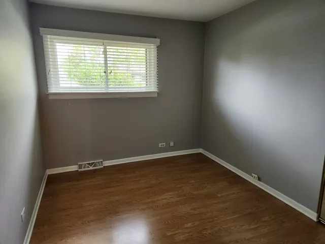 an empty room with a empty space and window
